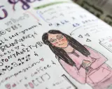 Zapiski w bullet journalu: co to jest? Rysunek dziewczyny, lista rzeczy do kochania: praca, bieganie, spontaniczność, kawa.