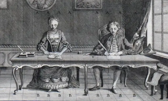 Para pisze przy stole z piórami i atramentem.
